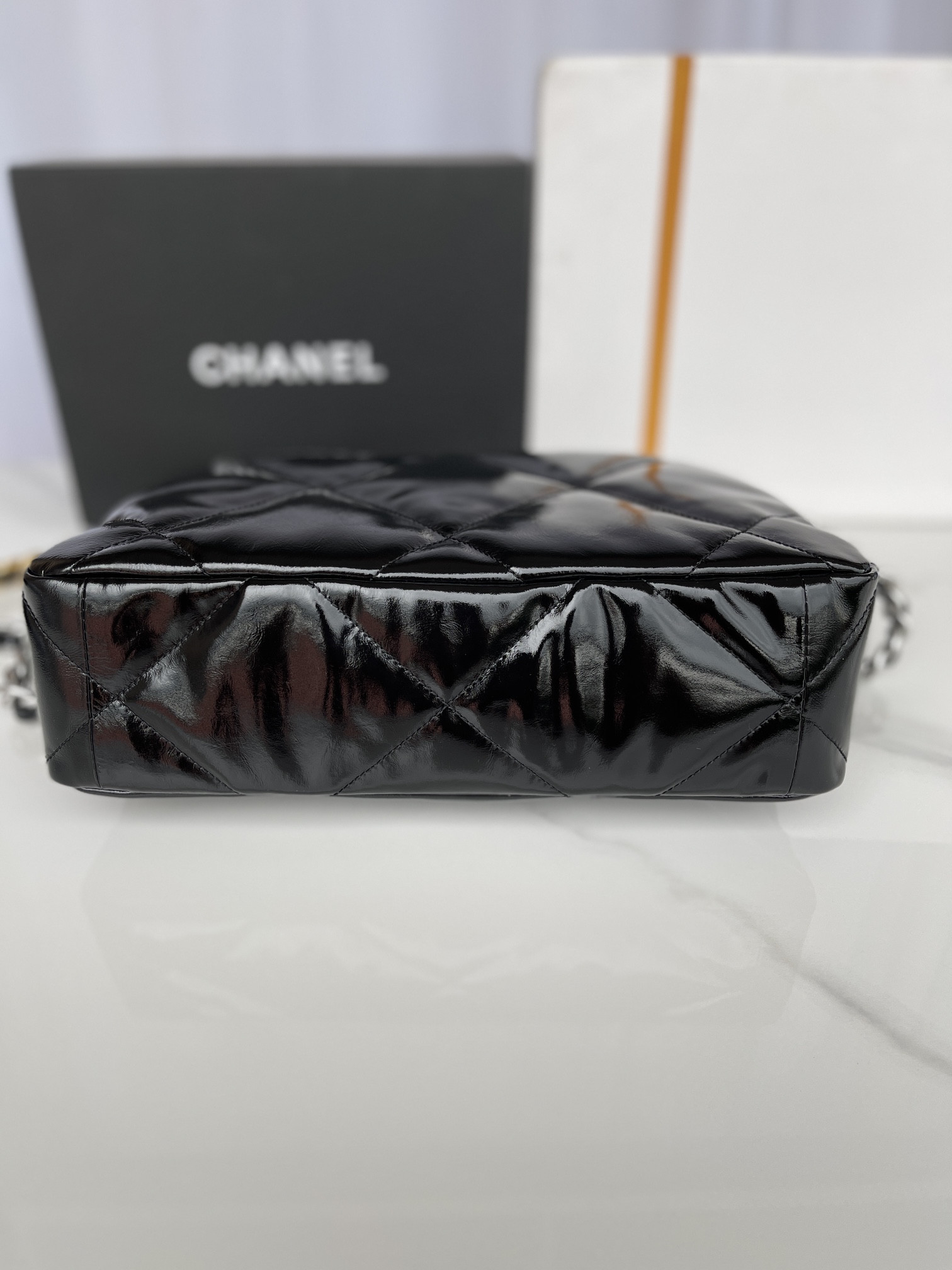 Ch*el 19 large handbag shiny leather, gold-tone, silver-tone & ruthenium-finish metal black 7.8 × 11.7 × 3.9 in