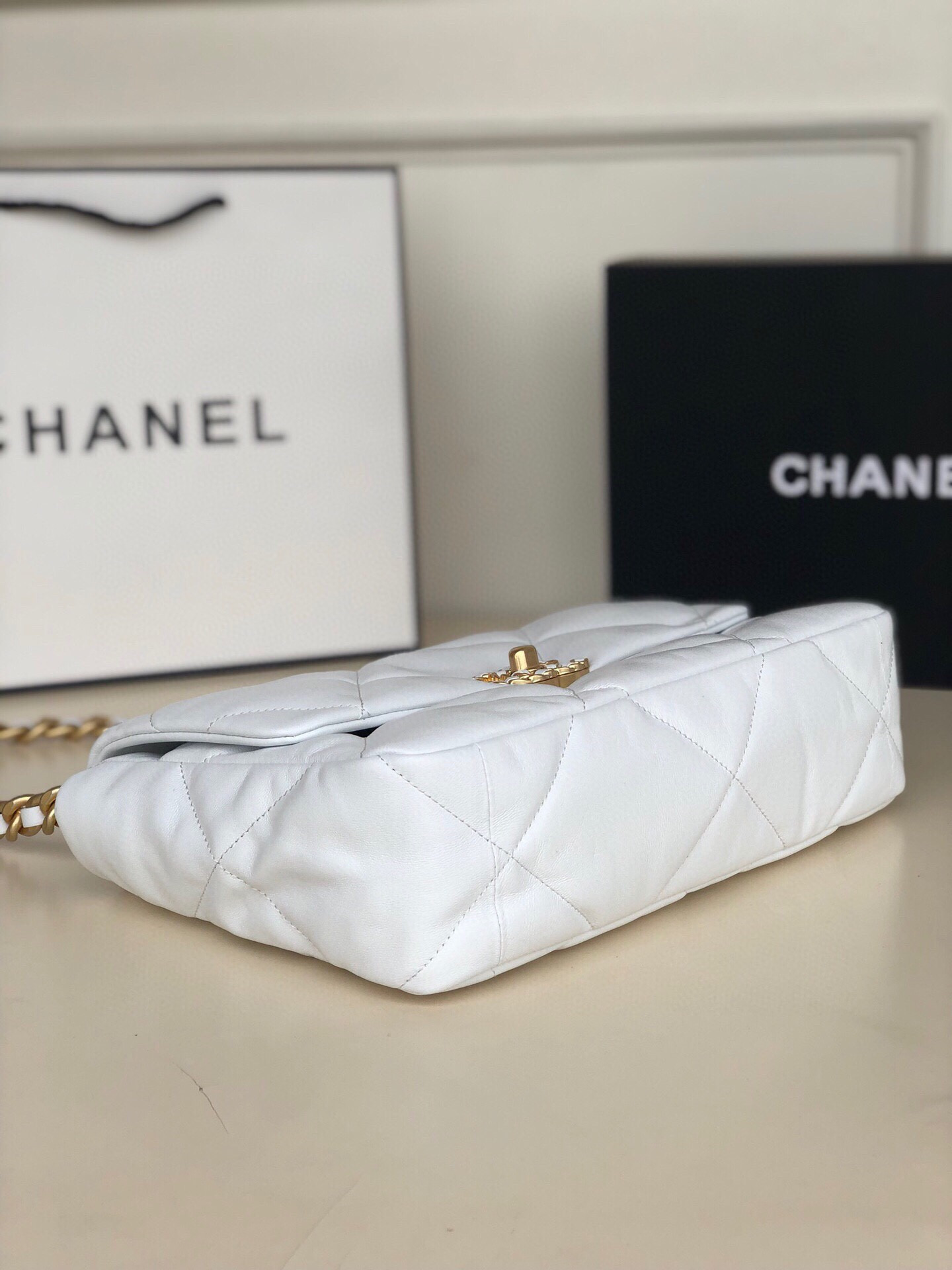 Ch*el 19 large handbag shiny leather, gold-tone, silver-tone & ruthenium-finish metal white 7.8 × 11.7 × 3.9 in